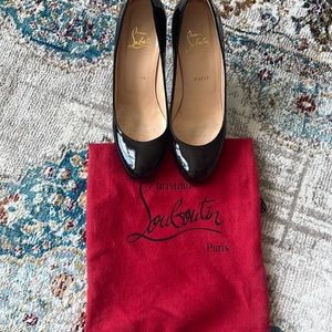 Christian Louboutin black patent leather heels.